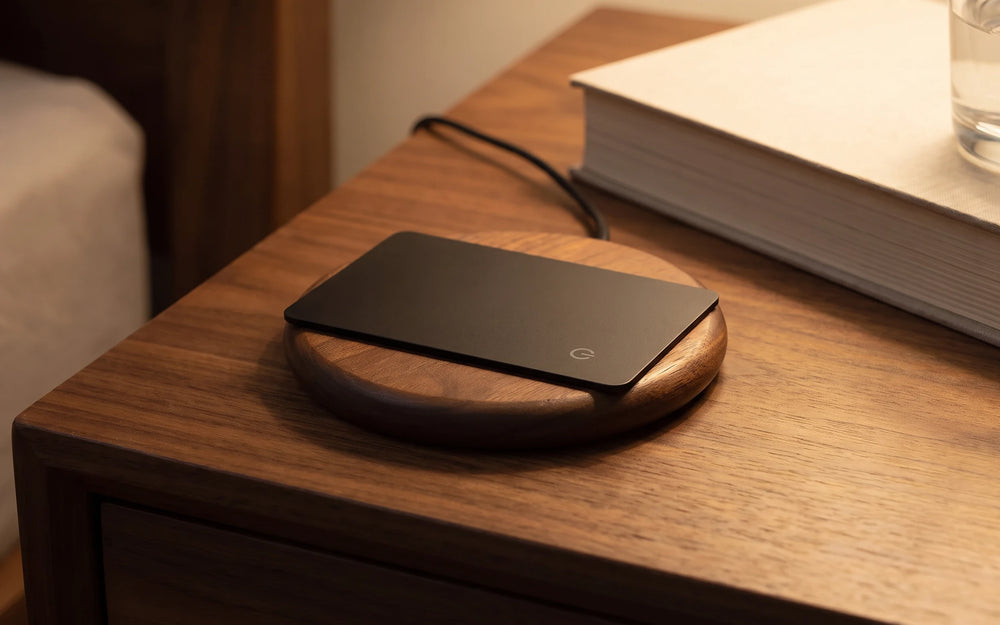 Wireless charging pad on a bedside table